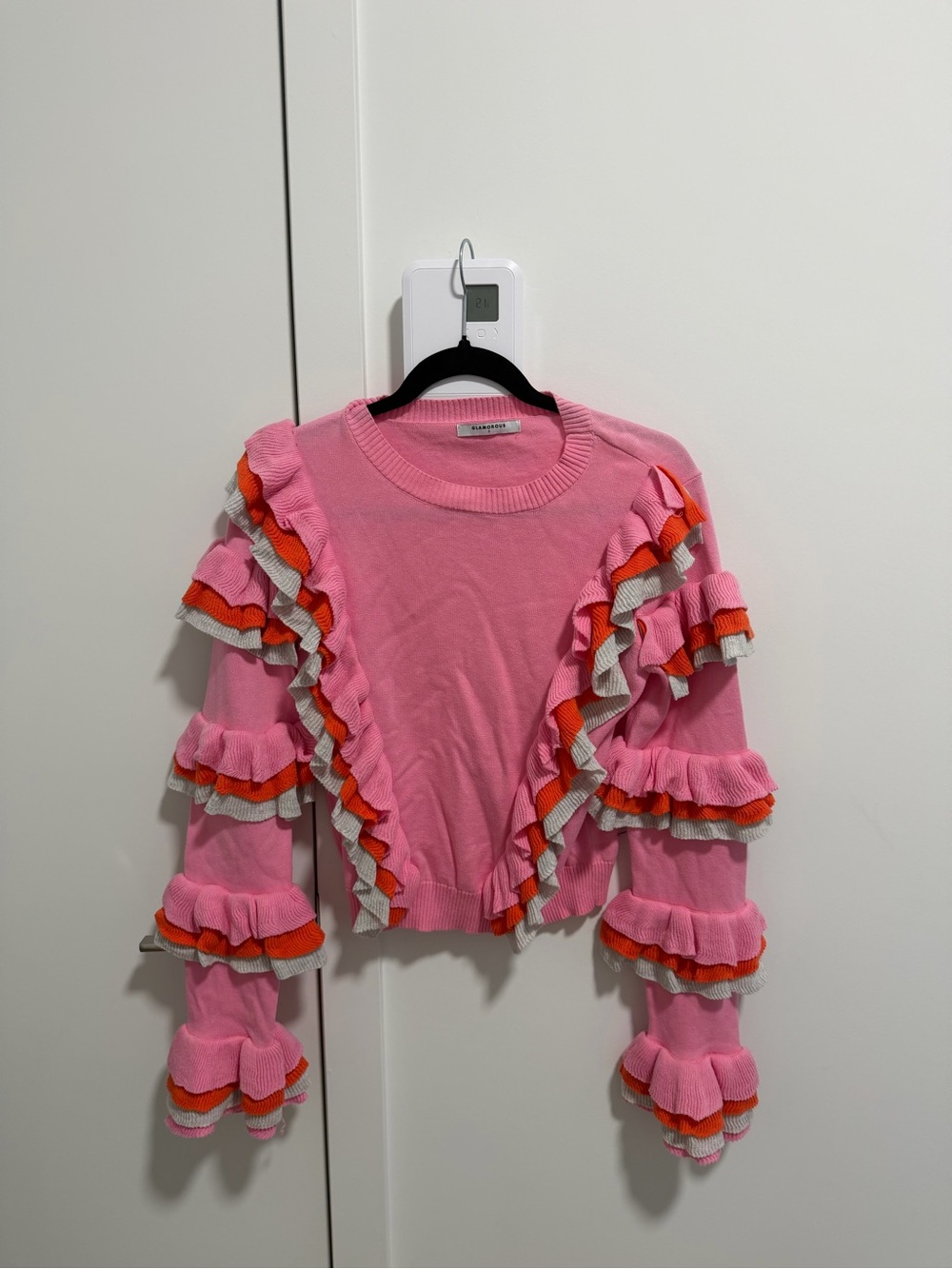 Glamorous Pink Ruffle Knit Sweater with Orange and Cream Accents